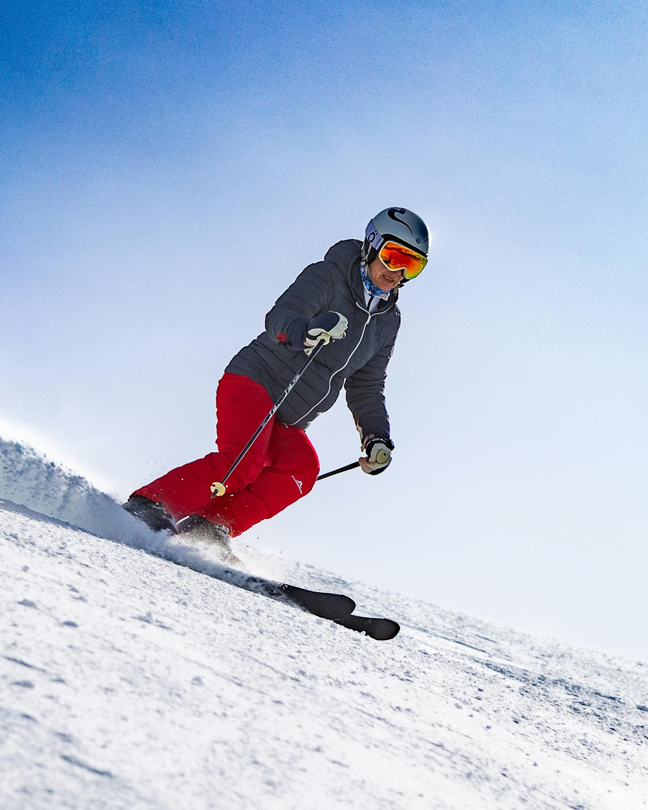 Skier Carving Down Snowy Slope
