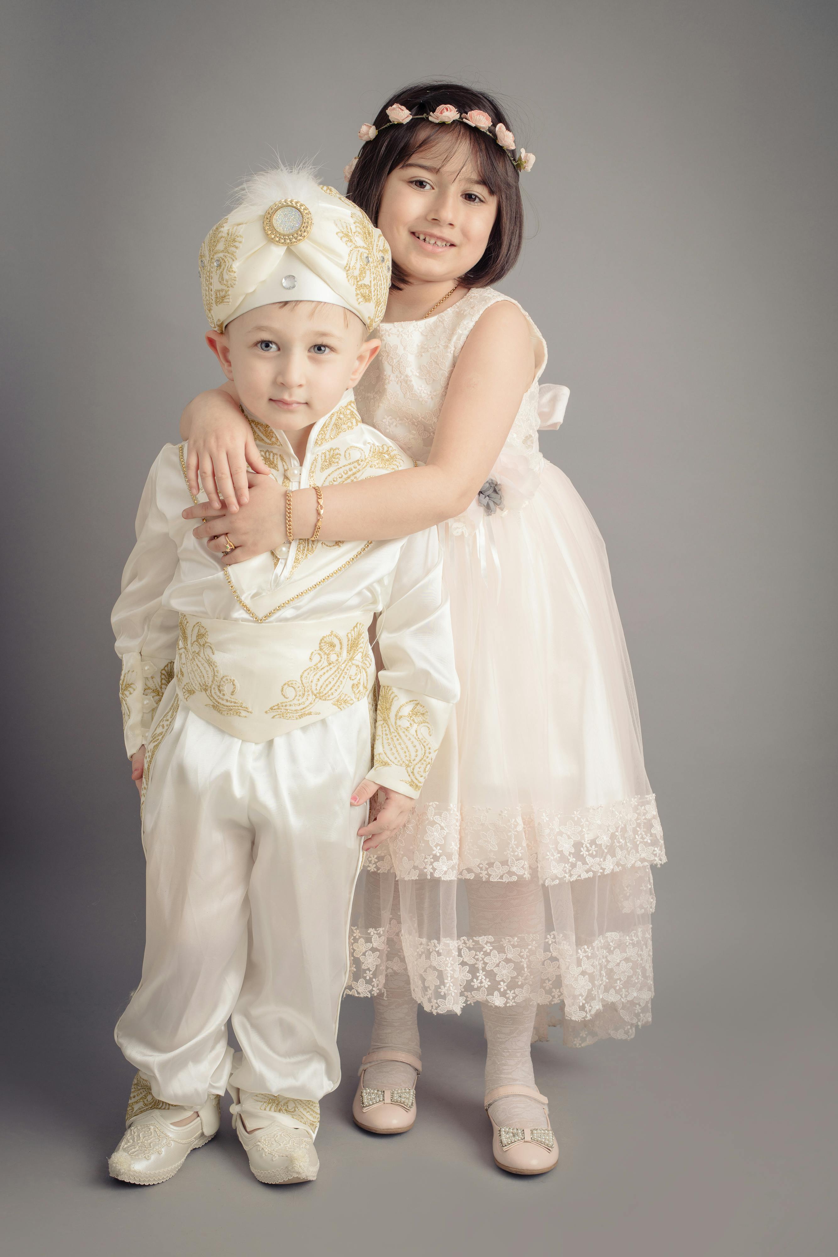 Two Children in Formal Traditional Outfits