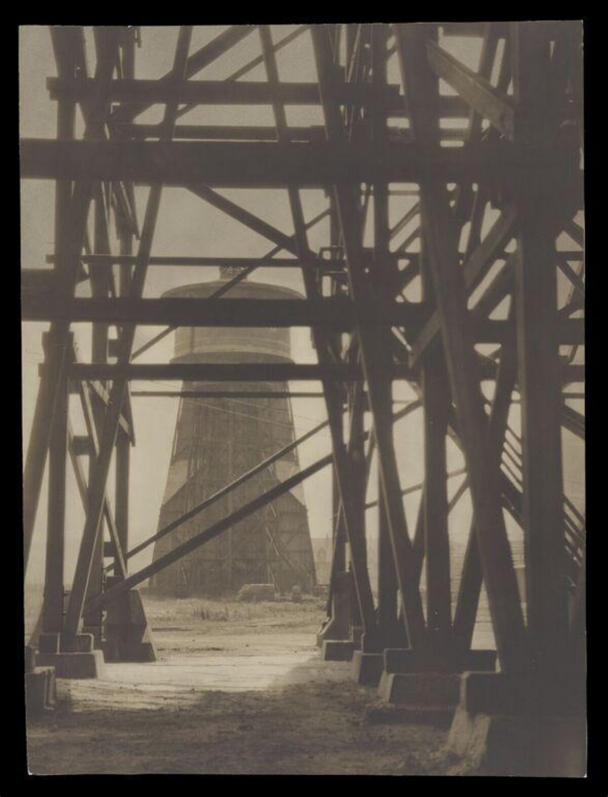 Water Tower Seen Through Bridge Framework