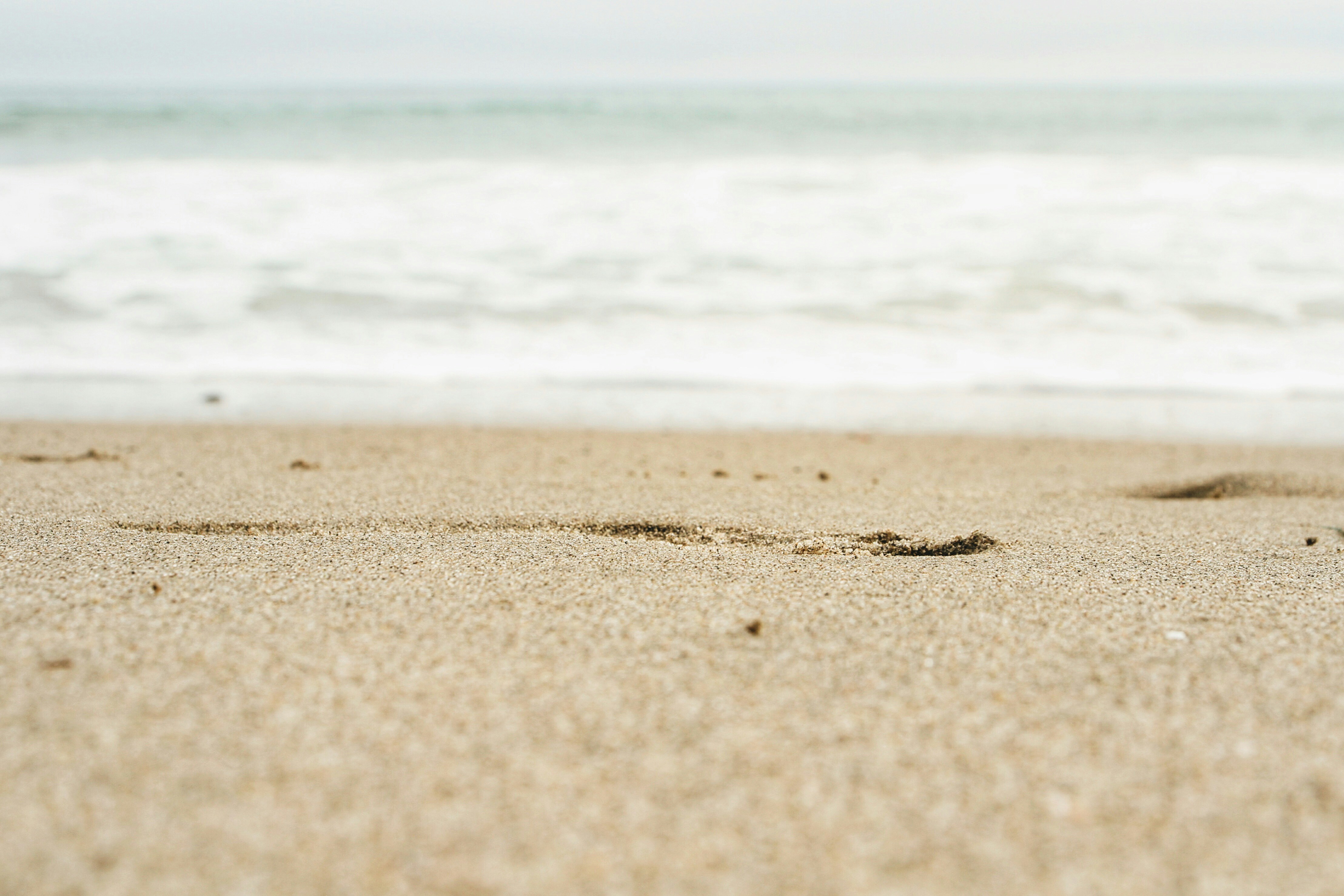 Footprints on Sandy Beach