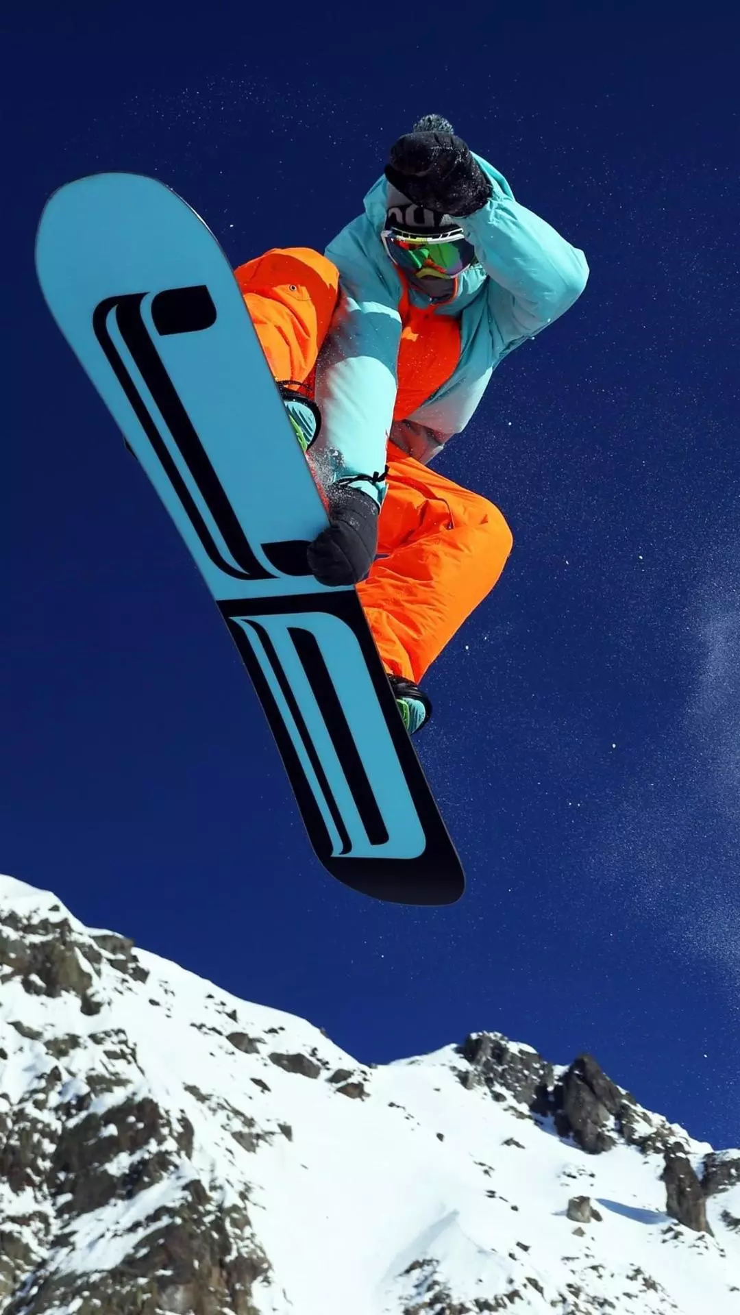 Snowboarder Mid-Air Mountain Jump