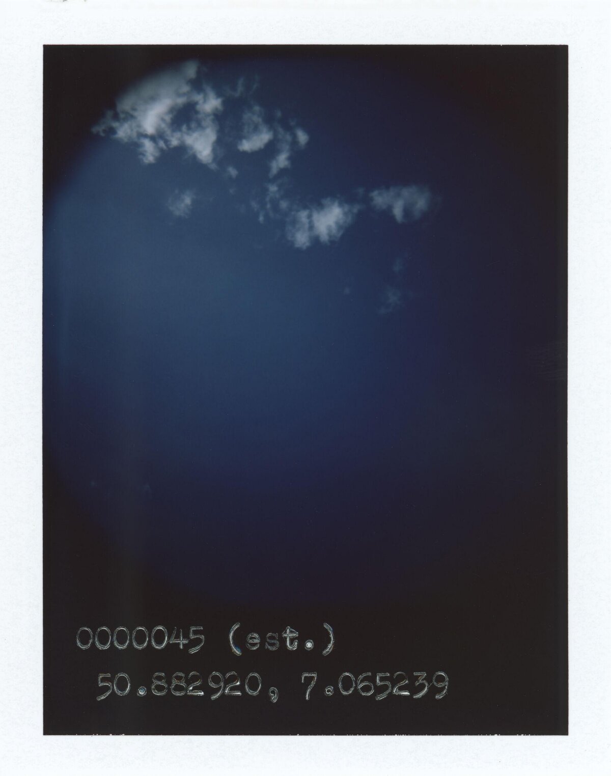 Deep Blue Sky with Scattered Clouds