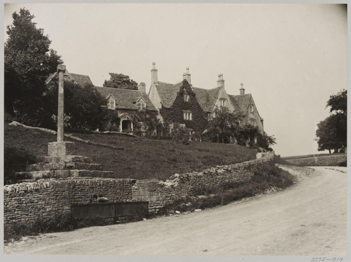 Old Stone Cross and Village Cottages