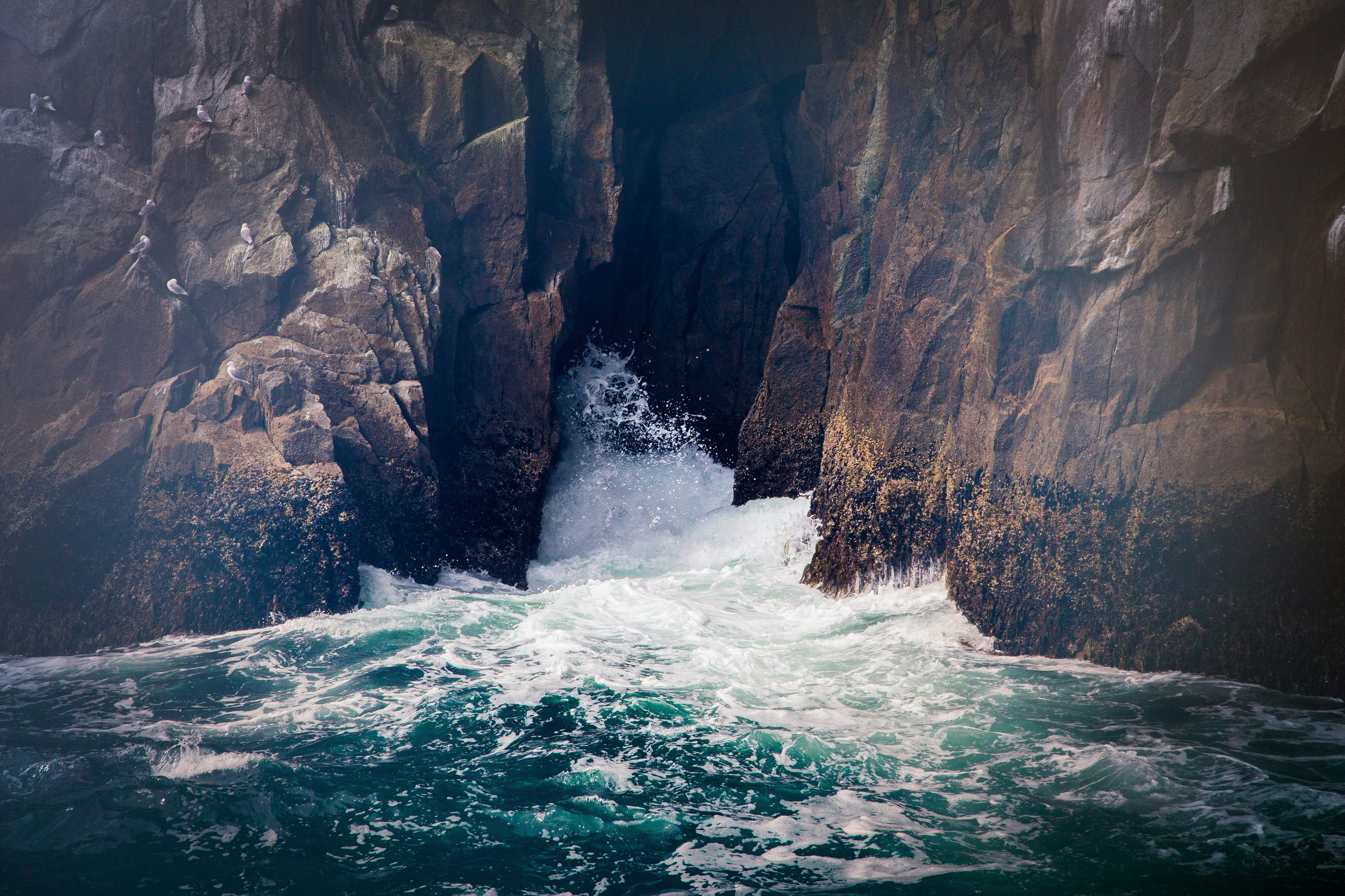 Waves Crashing Into Coastal Cliff