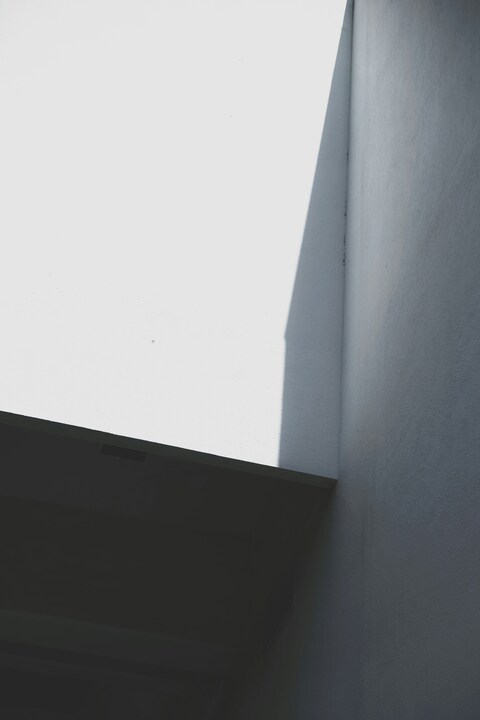 Corner of White Building with Light and Shadow