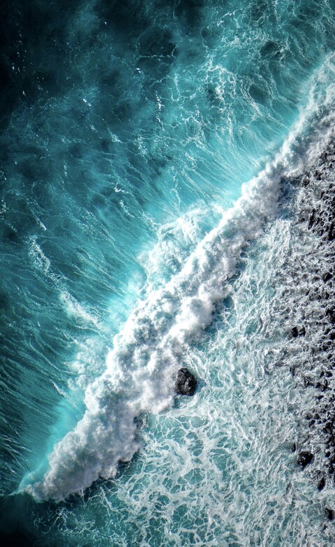 Aerial View of Breaking Ocean Wave