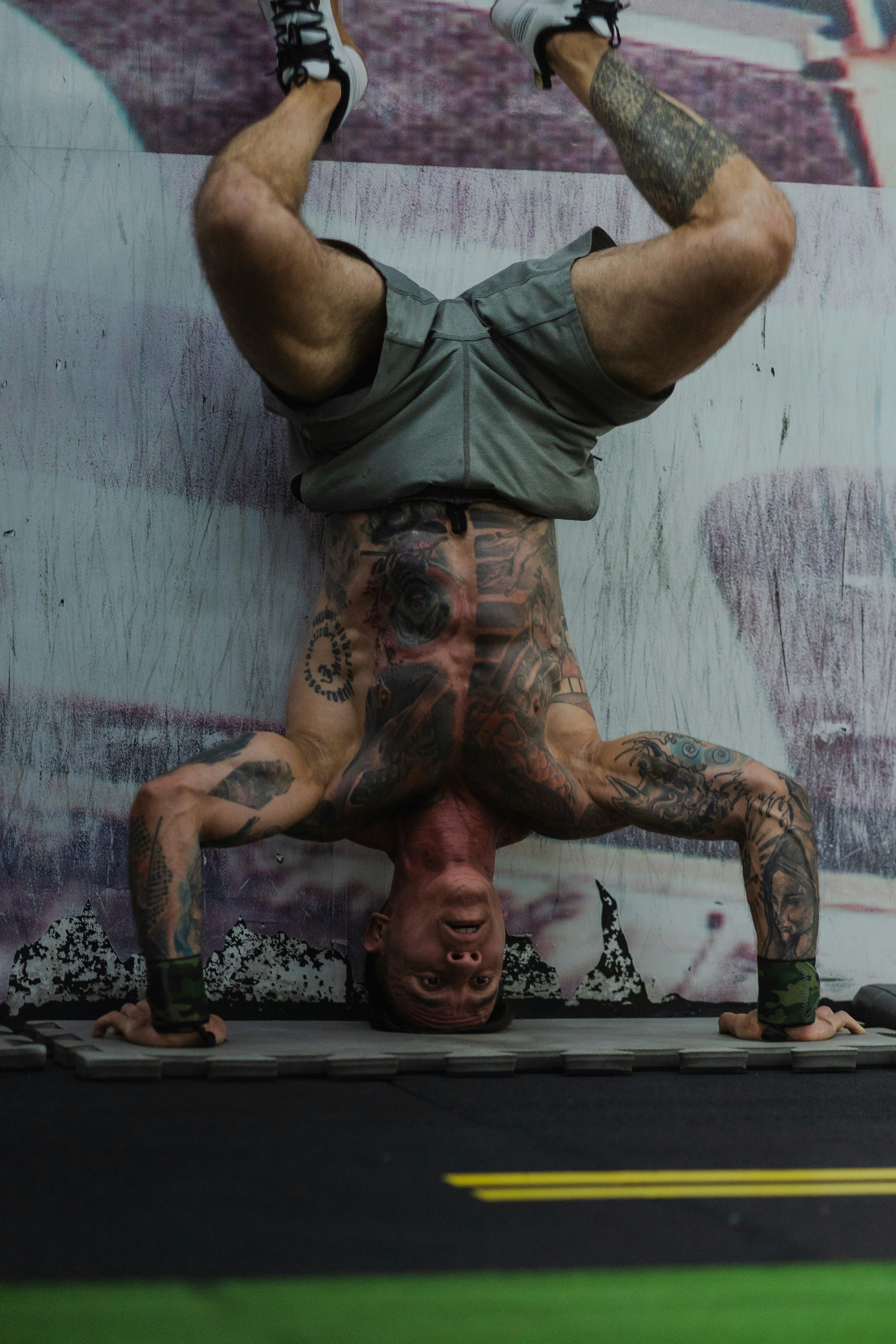 Tattooed Athlete Doing Inverted Workout