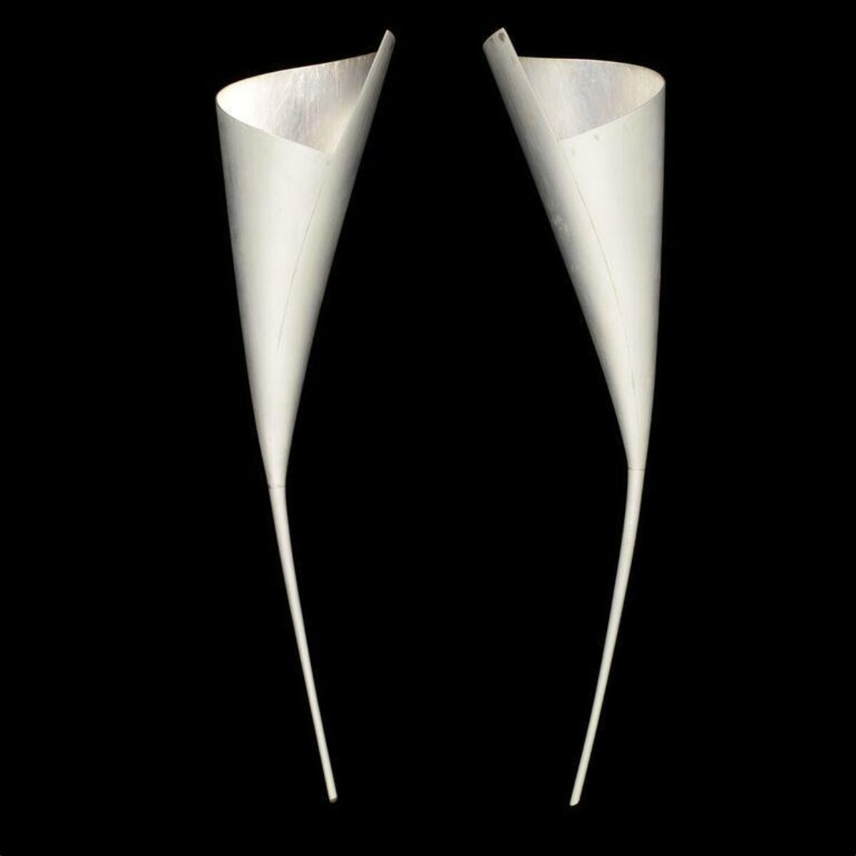 Two White Paper Funnels On Black Background