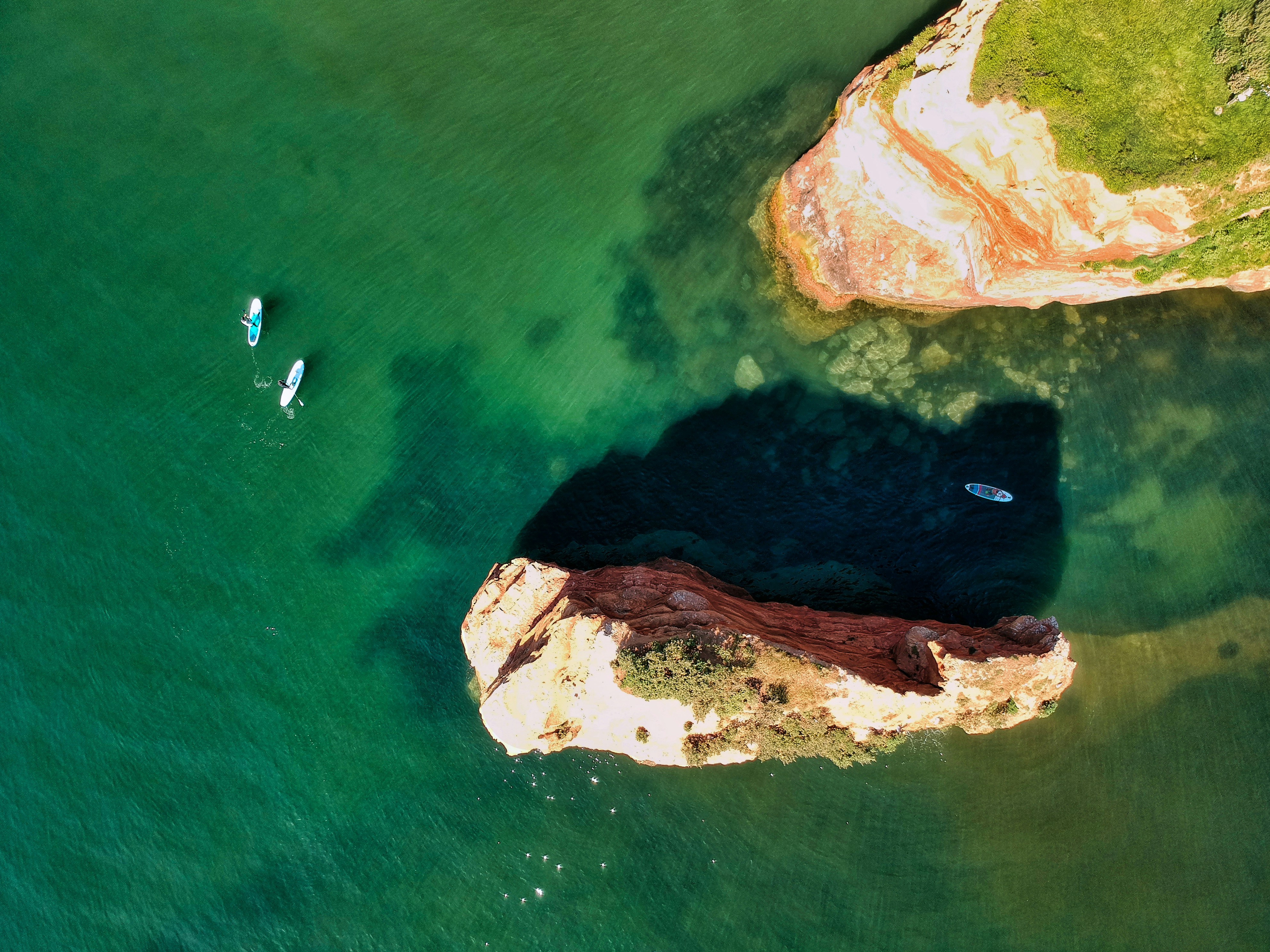 Aerial View of Coastal Paddleboarding