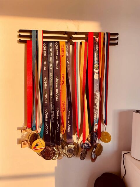 Collection of Sports Medals on Wall Display