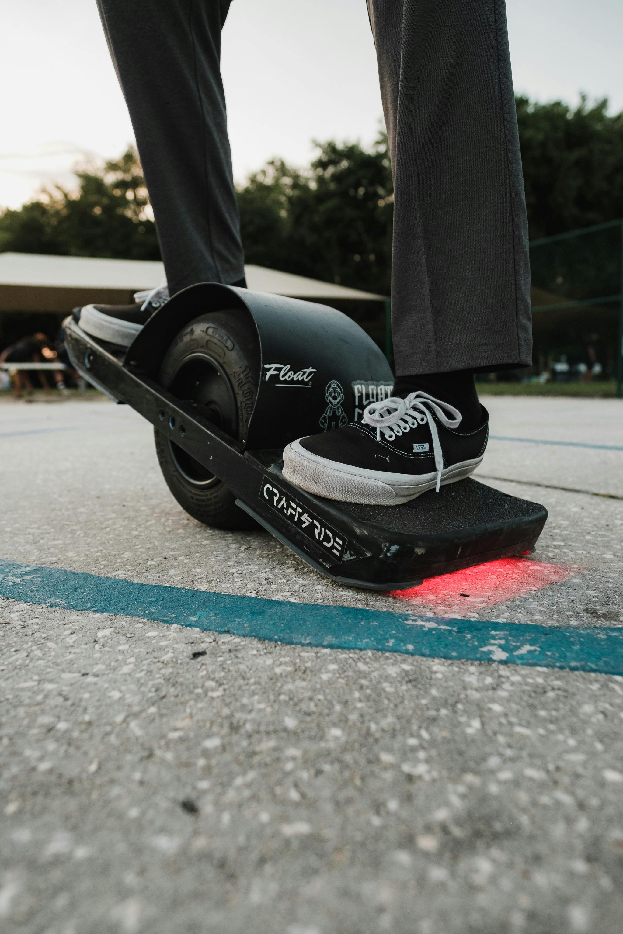 Rider on Single-Wheel Electric Skateboard