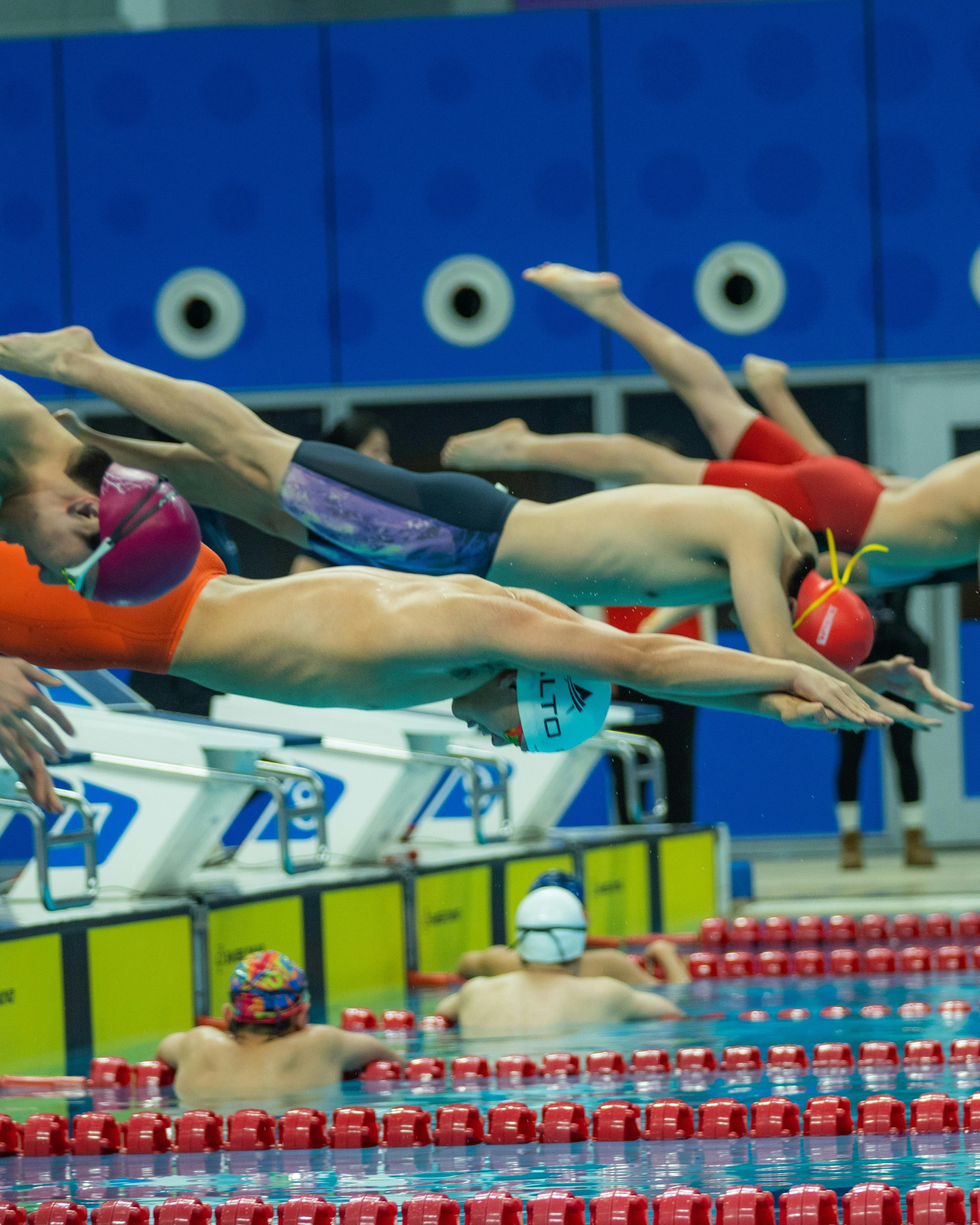 Swimmers Dive At Swimming Competition