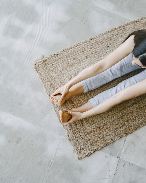 Woman Doing Seated Yoga Stretch