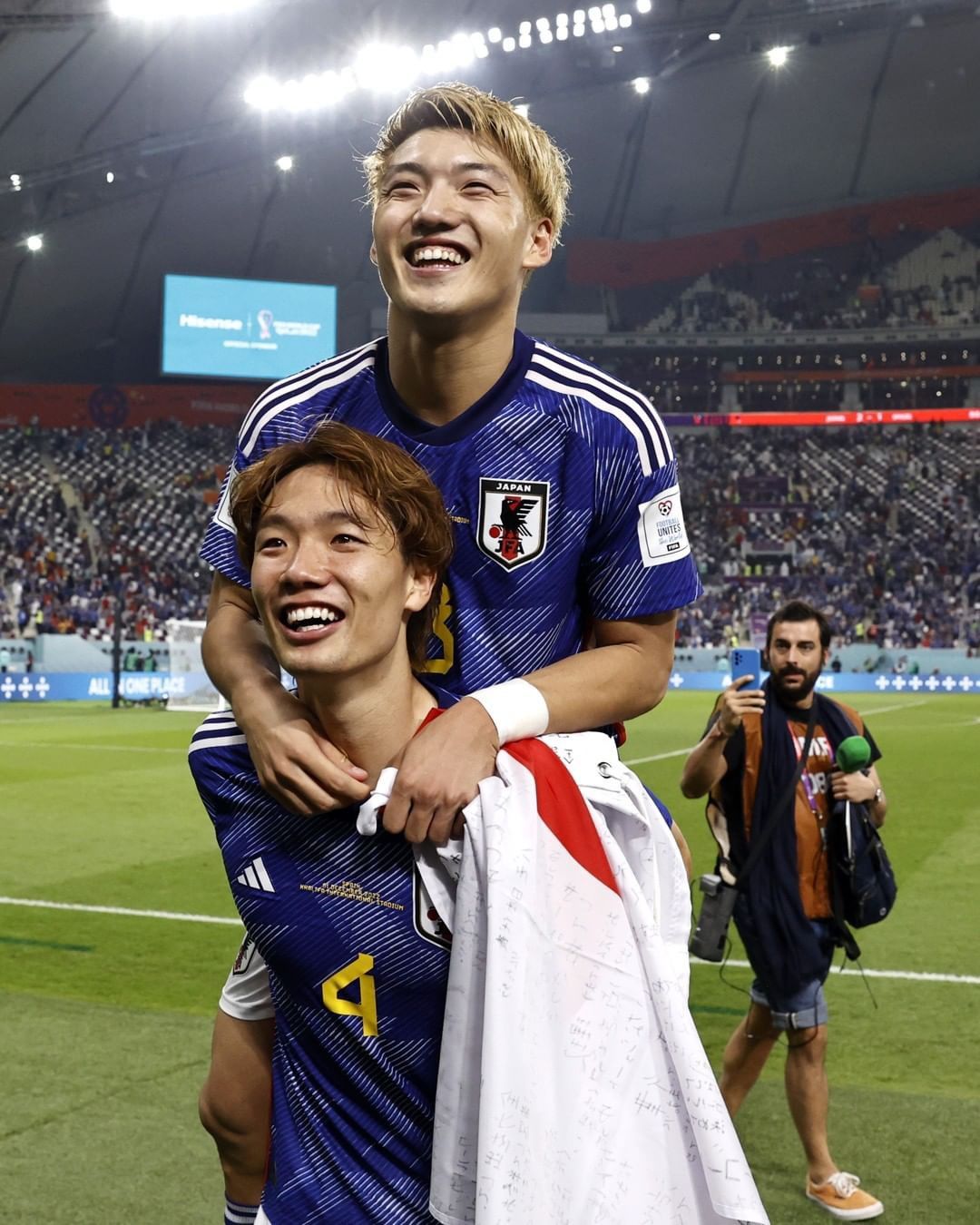 Japanese Soccer Players Celebrating Victory