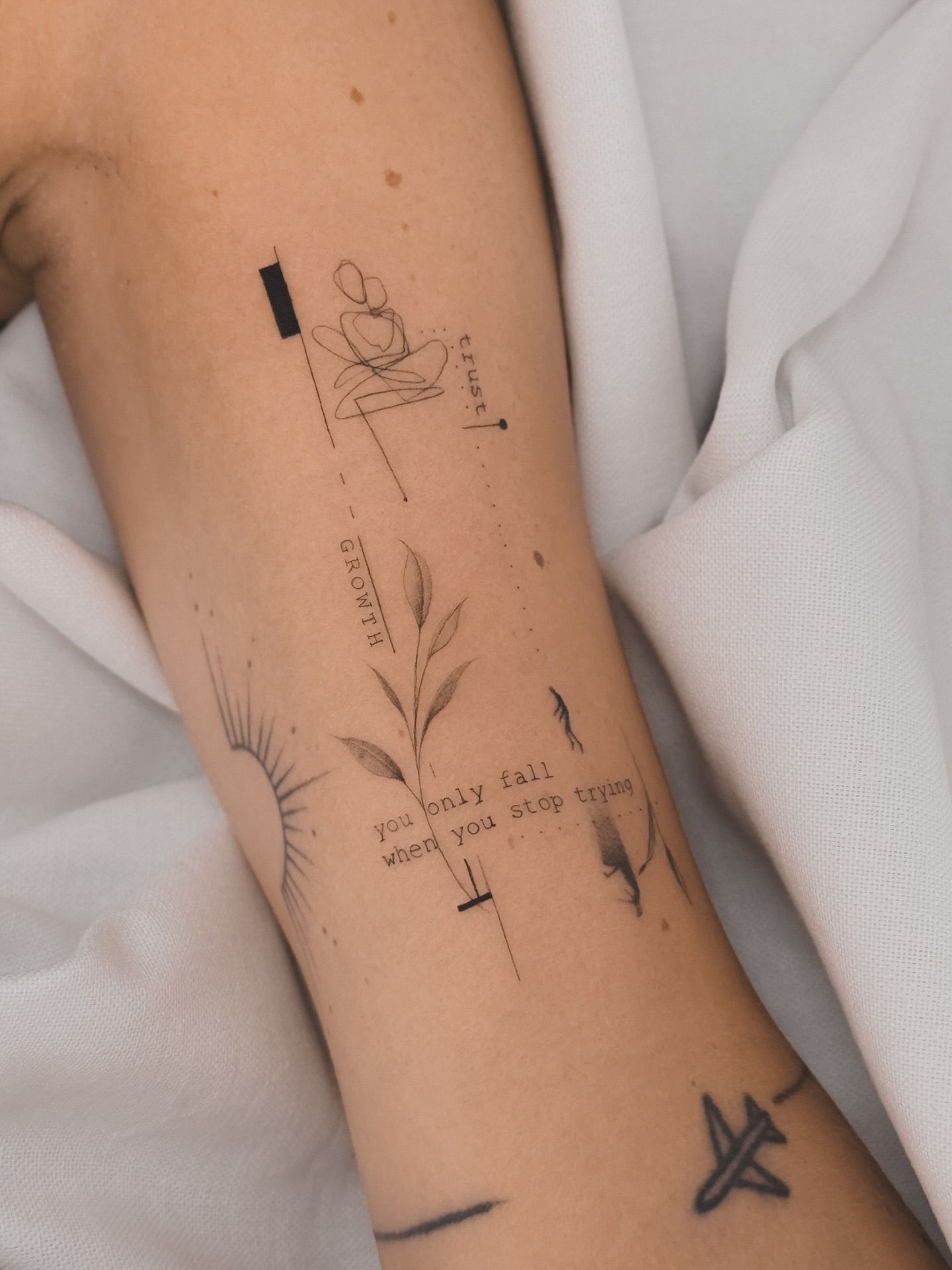 Minimalist Collage Tattoo On Arm