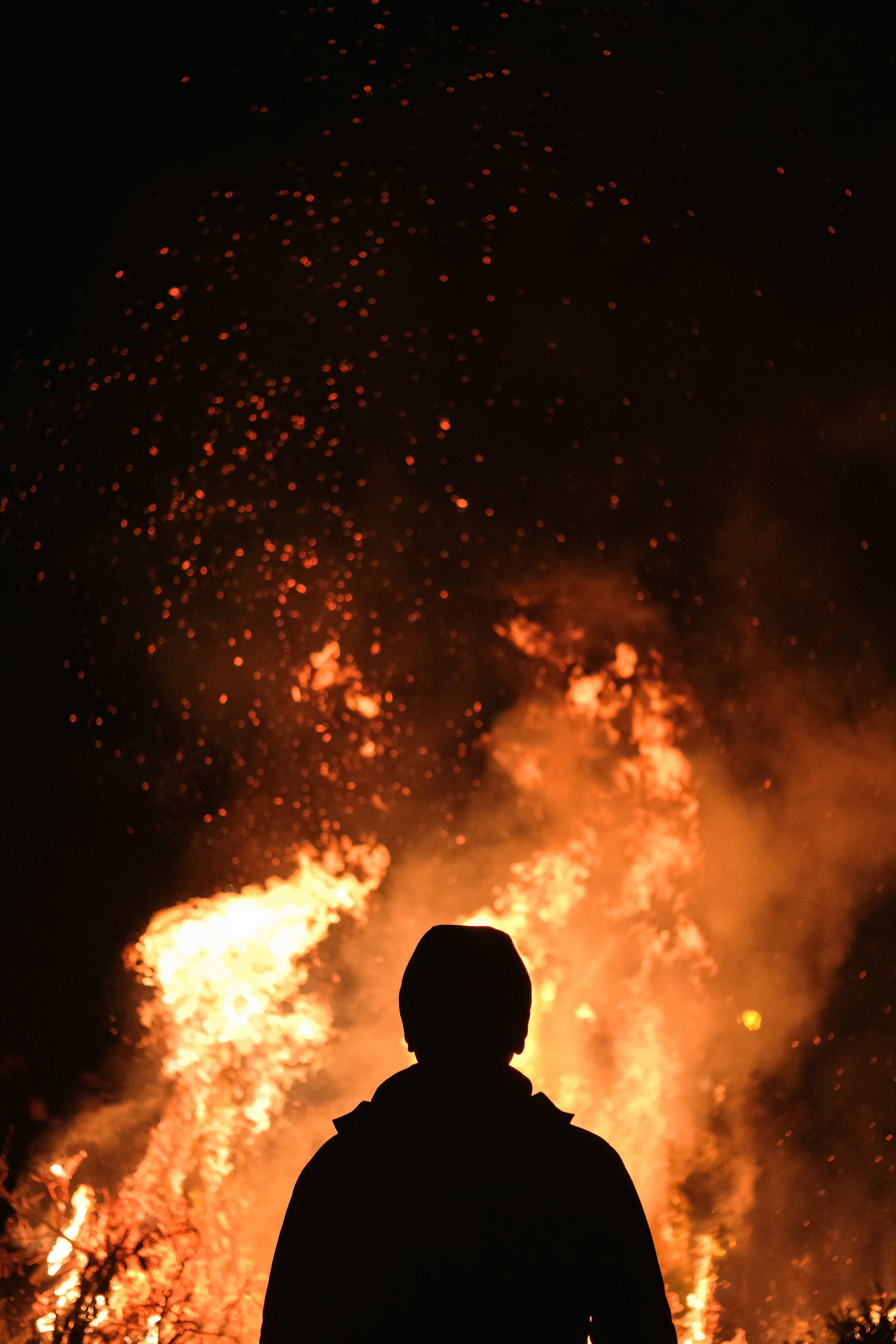 Silhouette Against Night Bonfire