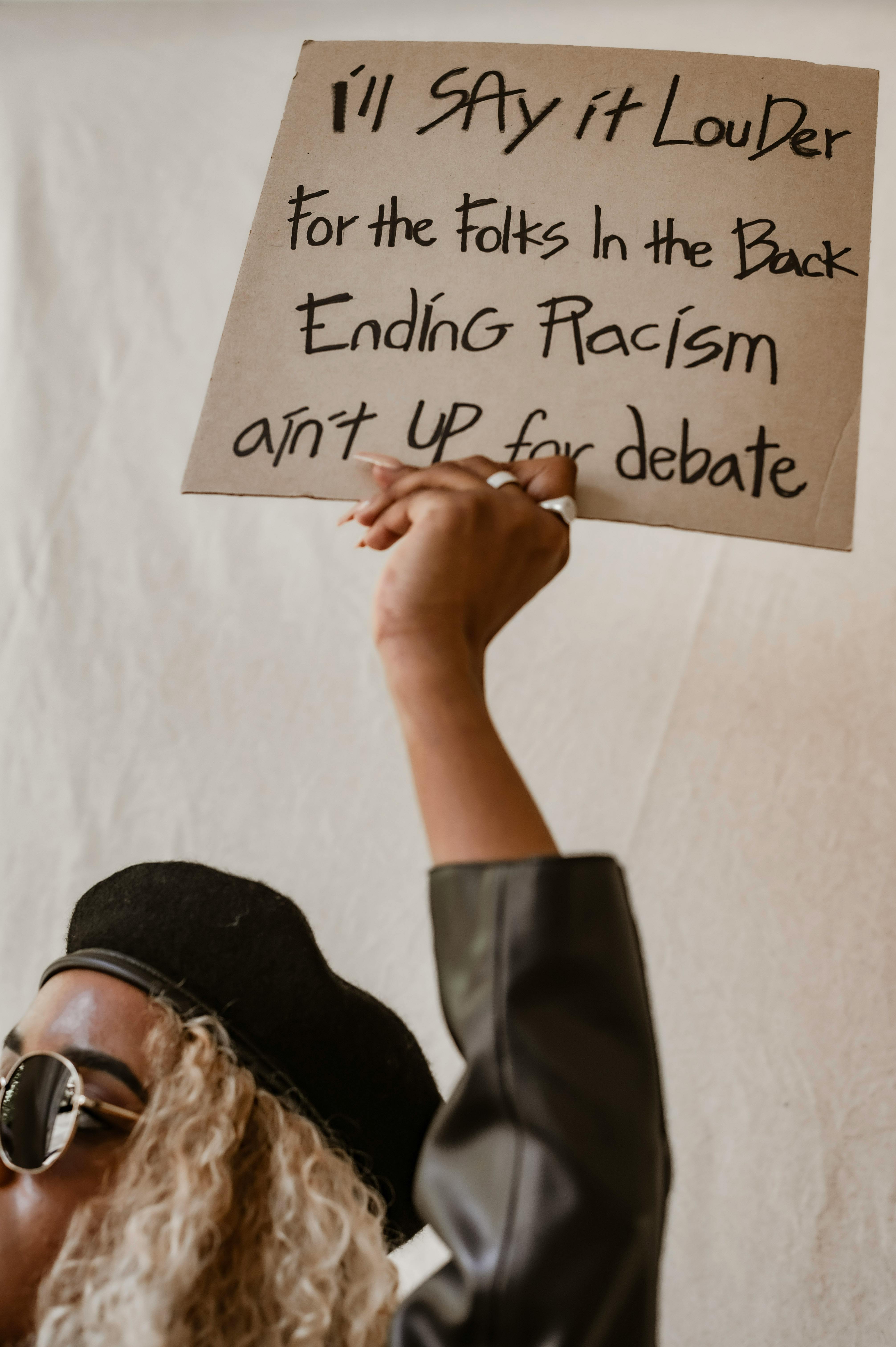 Anti-Racism Protest Sign Held High