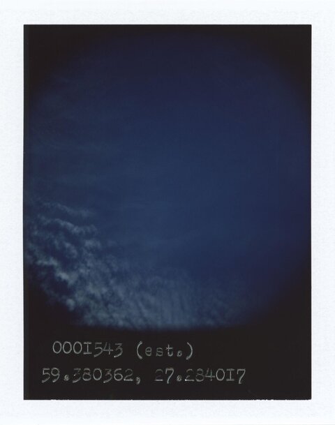 Dark Blue Sky with Scattered Clouds