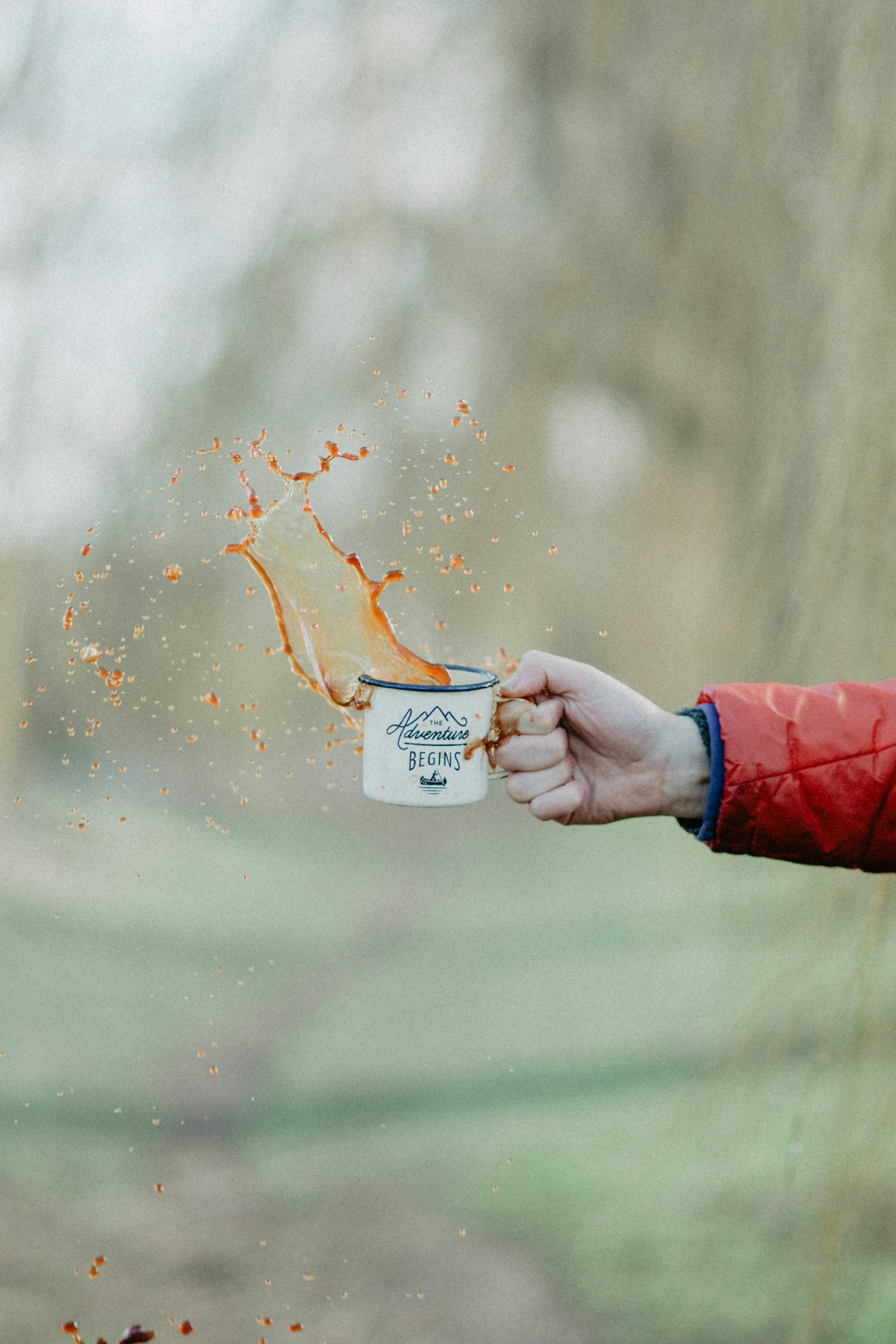 Splashing Coffee from Camping Mug Outdoors