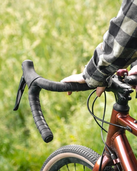 Cyclist Holding Gravel Bike Handlebars