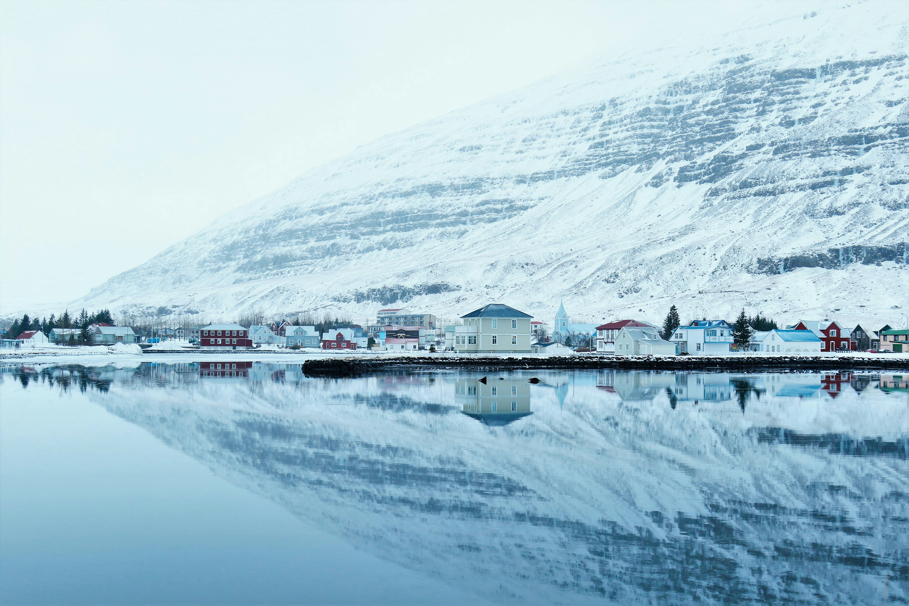 Snowy Town Water Reflection