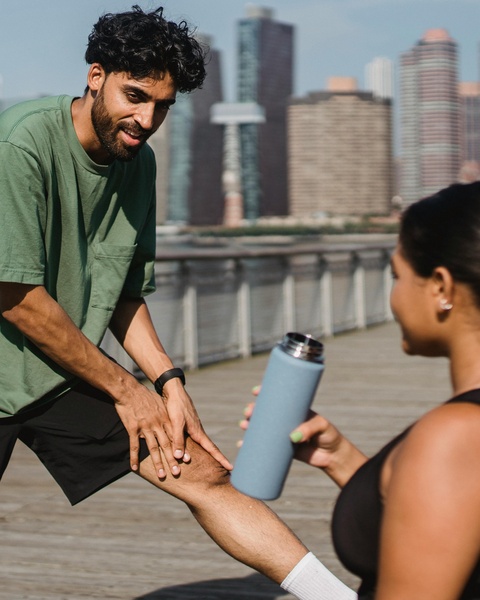 Two People Working Out by City Waterfront