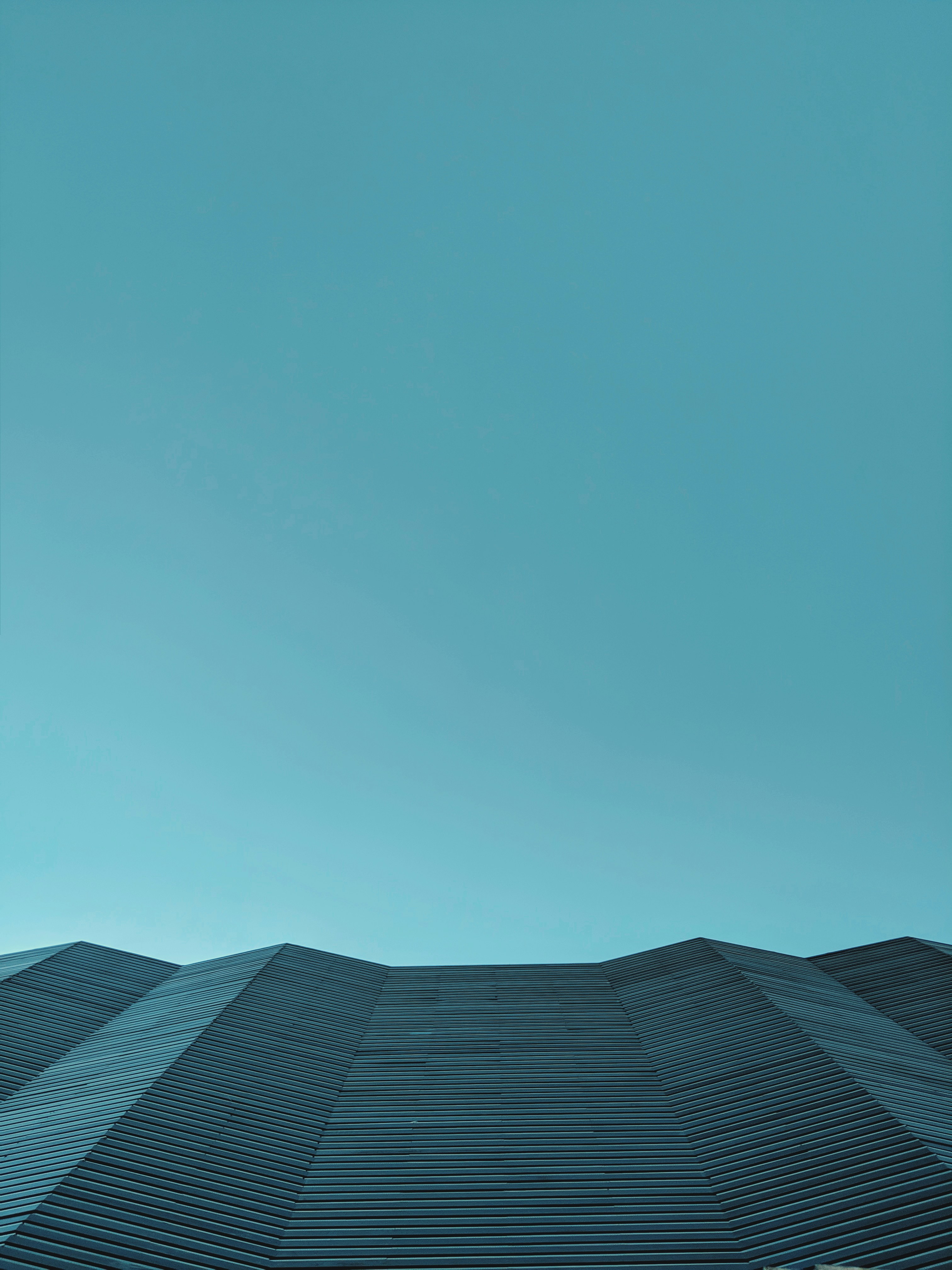 Geometric Folded Roof Under Clear Sky