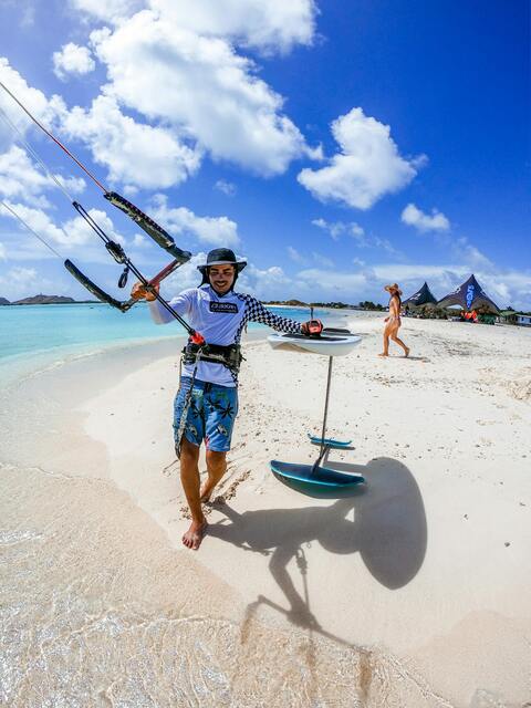 Kiteboarder Walking on Tropical Beach