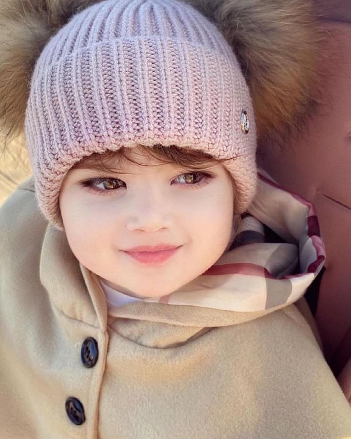 Smiling Toddler in Winter Clothing
