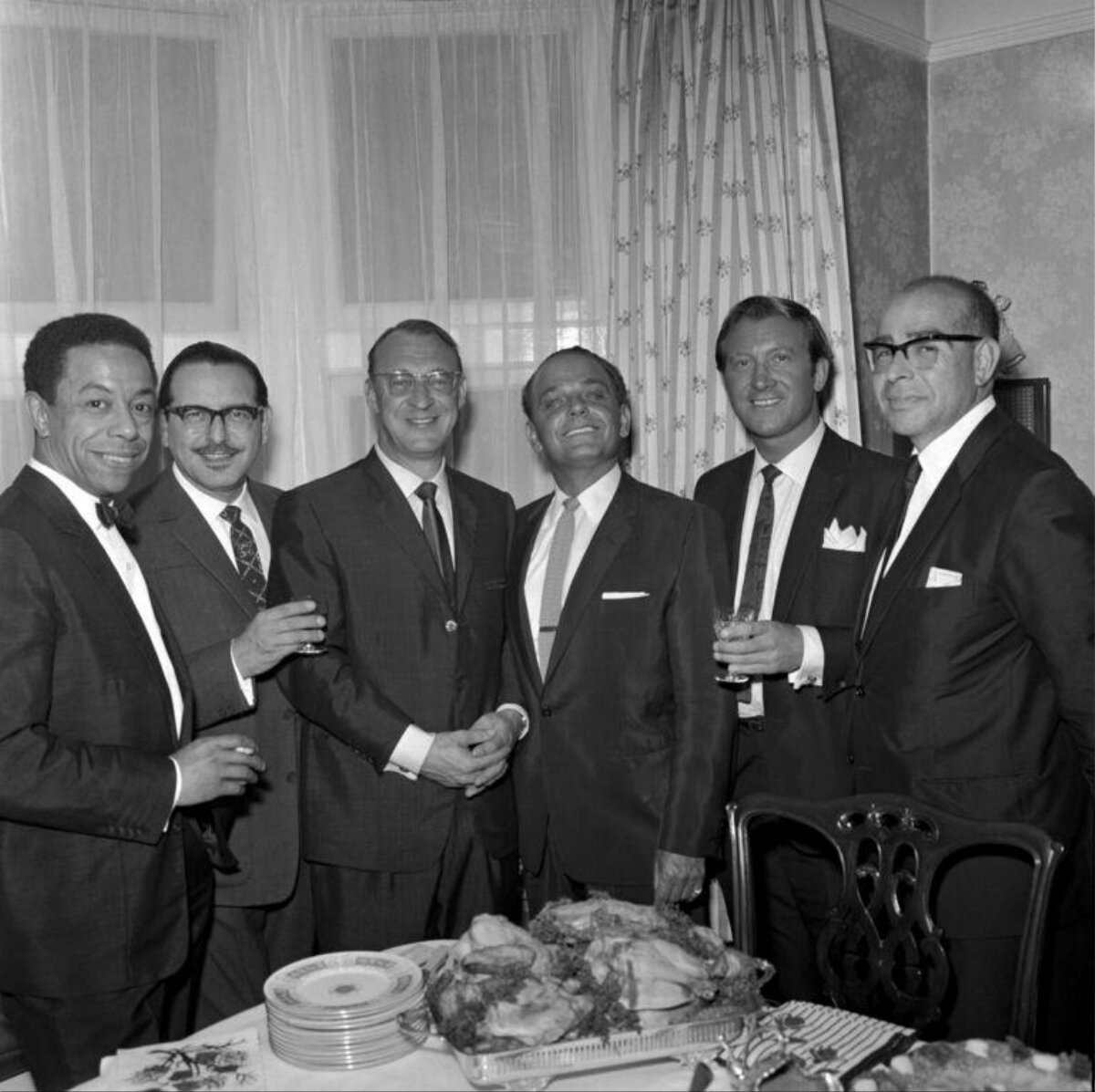 Six Men in Suits at Dinner Gathering