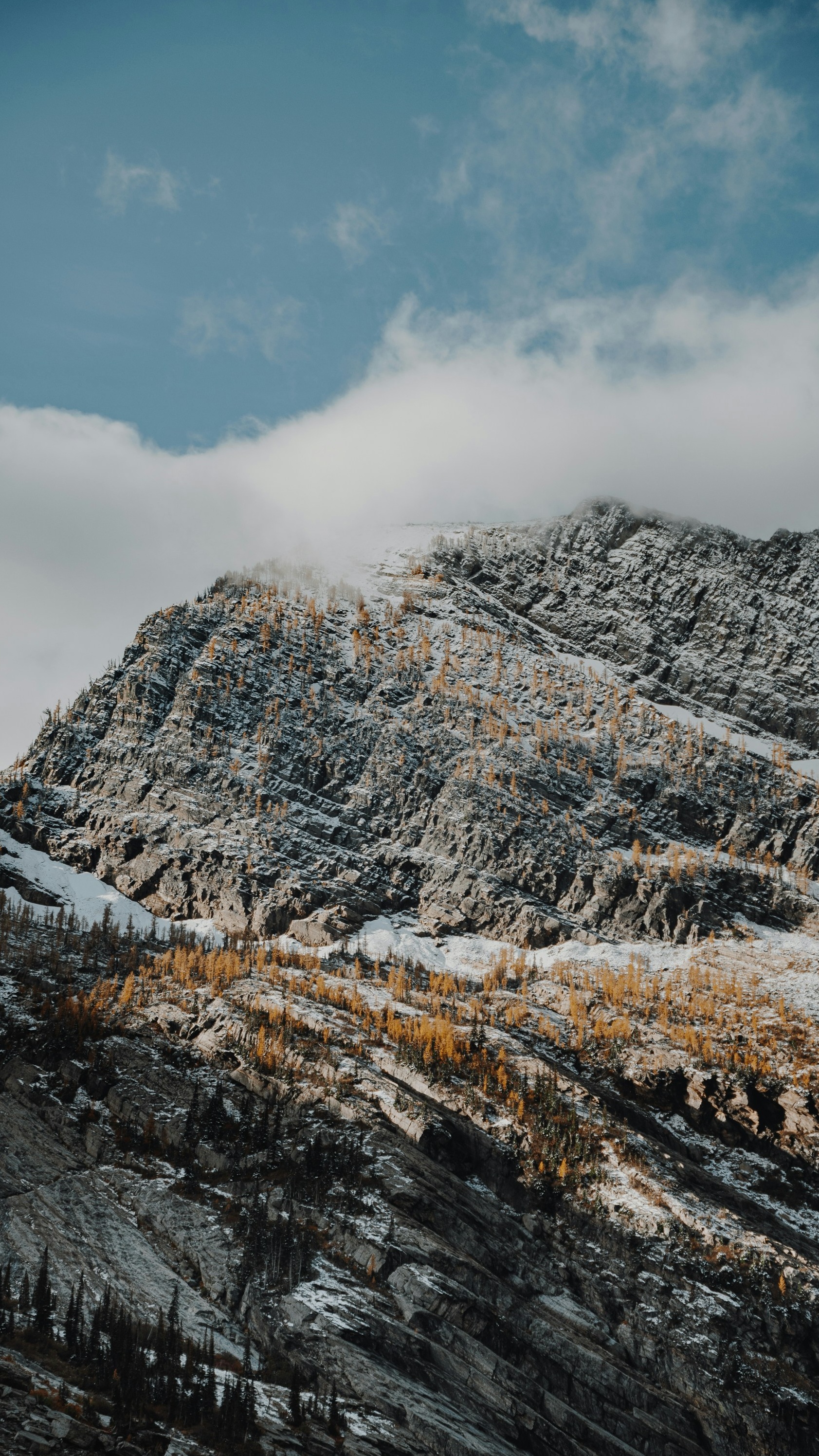 Cloud-Covered Snowy Rocky Mountain