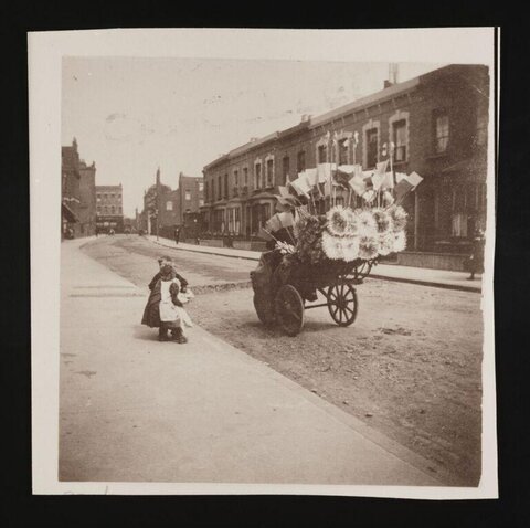 Vintage Street Scene with Children and Flower Cart