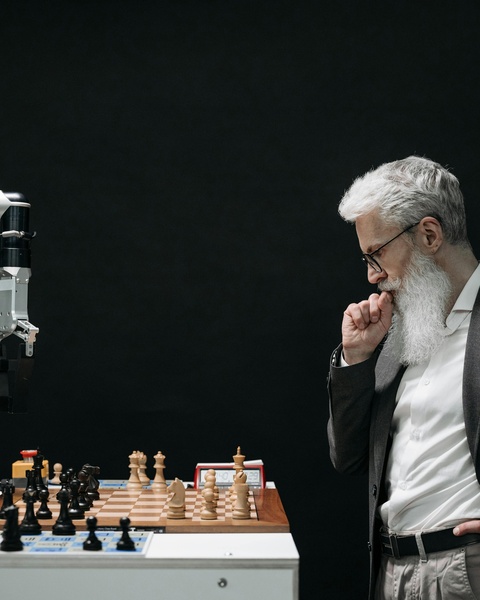 Man Competing Against Chess Robot