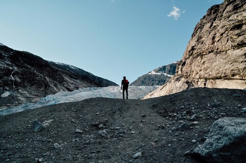 Hiker Facing Mountain Glacier