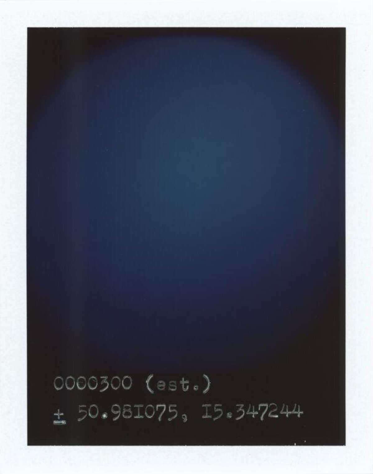 Polaroid with Handwritten Coordinate Data