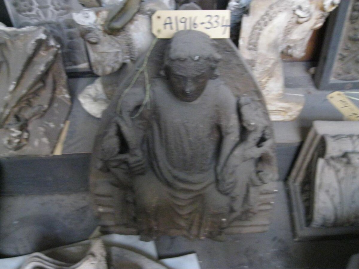 Tagged Kneeling Stone Sculpture
