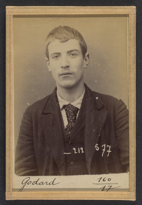 Vintage Mugshot Portrait of Godard