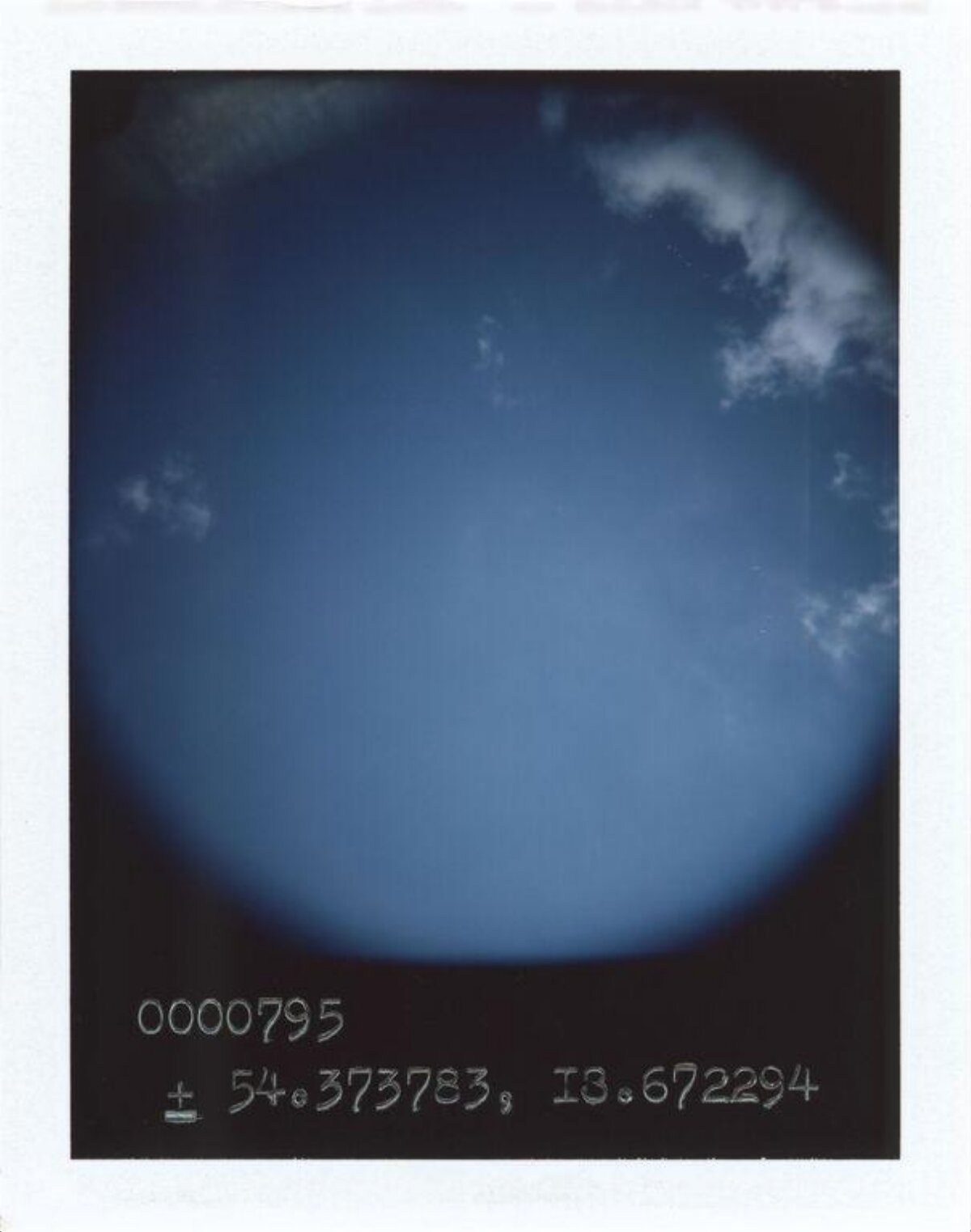 Polaroid Shot of Blue Sky with Clouds
