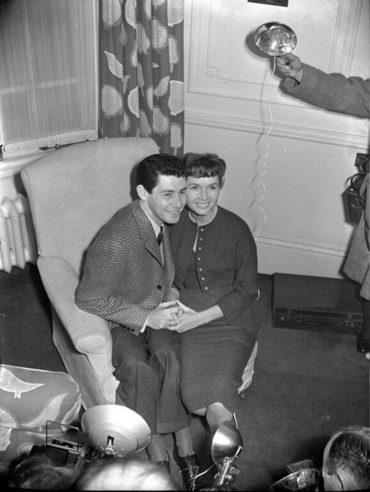 Smiling Couple Interviewed by Reporters