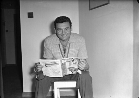 Man Reading Hit Parade Magazine
