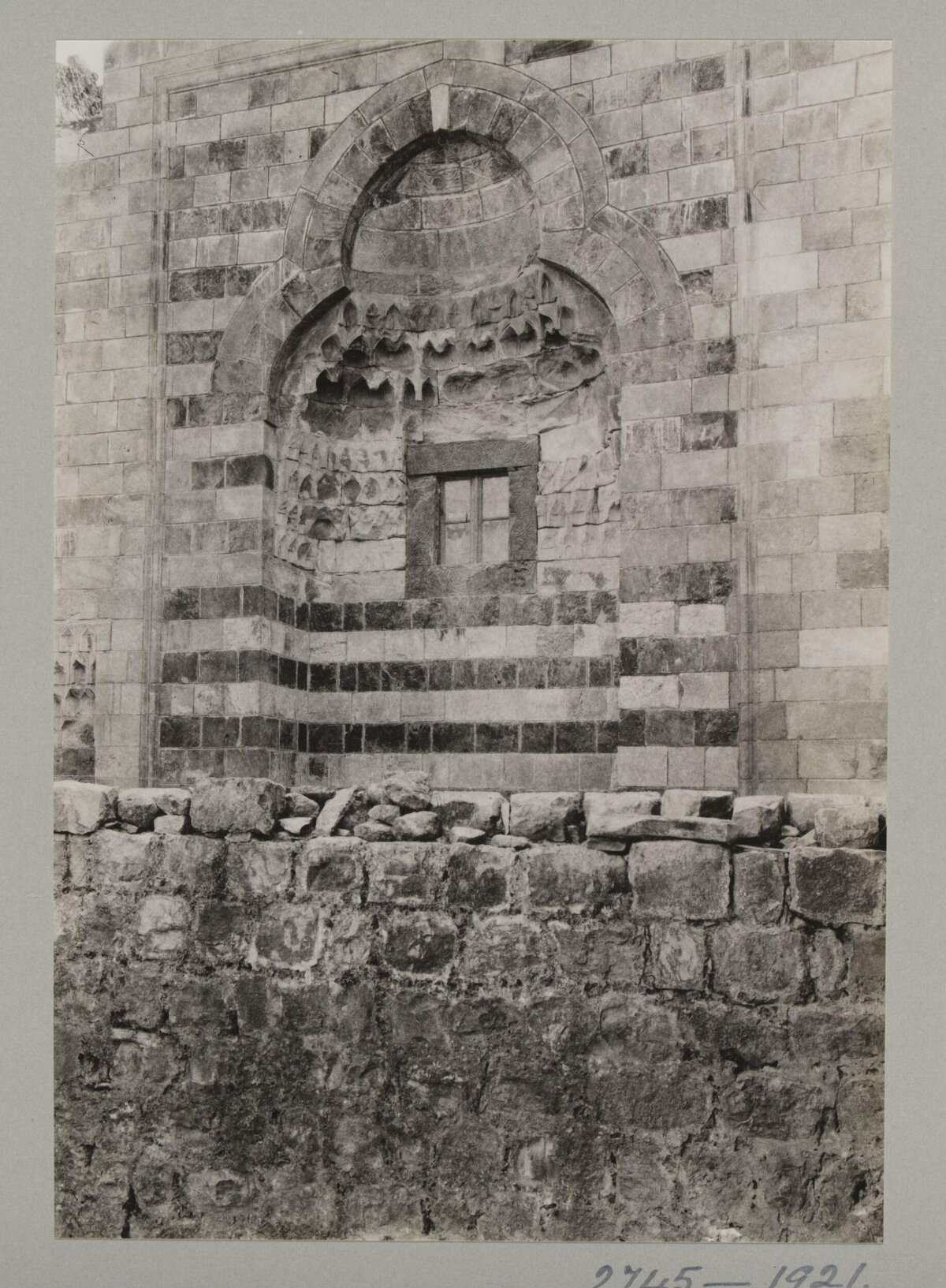 Historic Arched Niche on Stone Wall