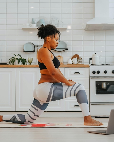 Woman Doing Home Workout In Kitchen