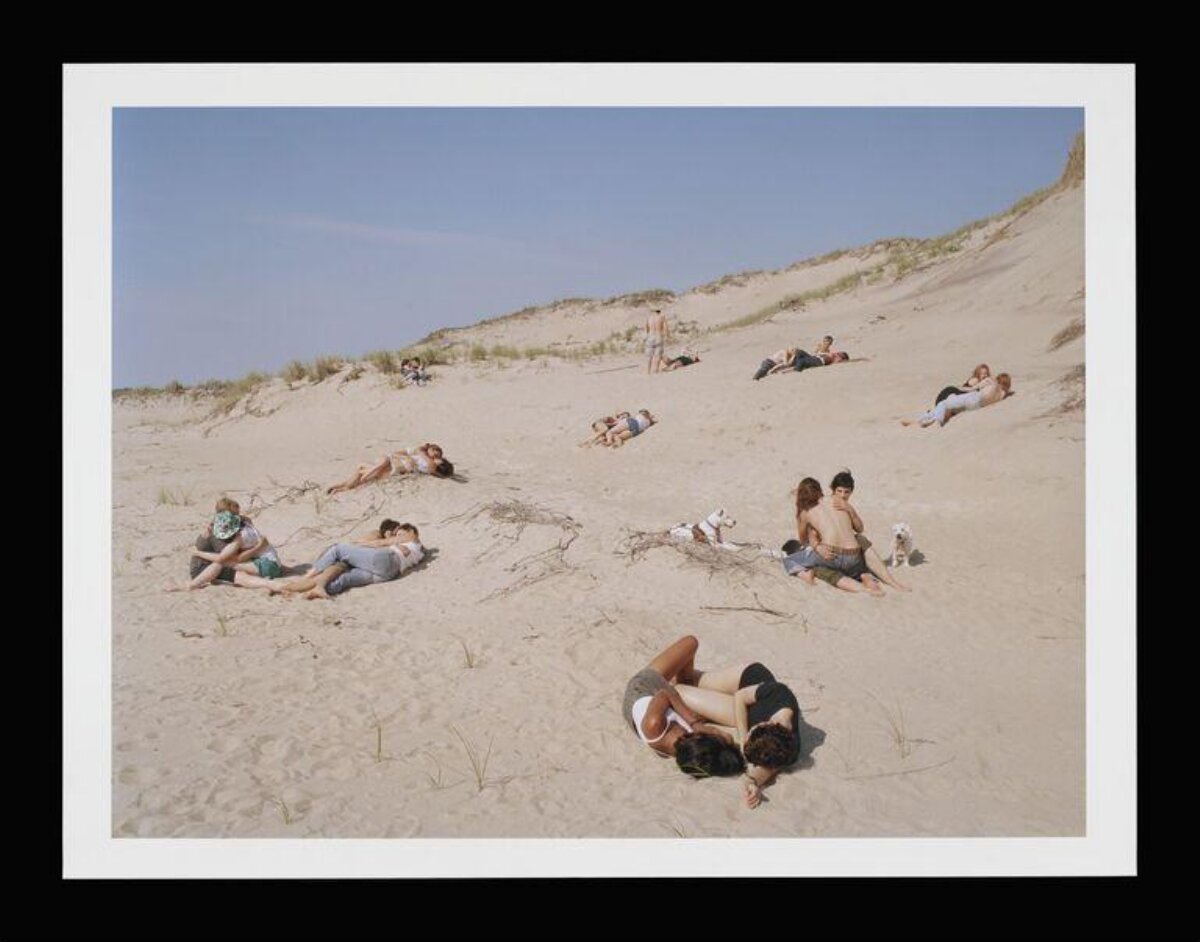 Couples Resting on Sand Dune Beach