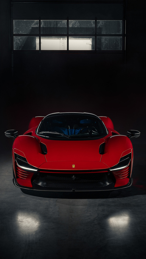 Red Ferrari Parked in Dark Garage
