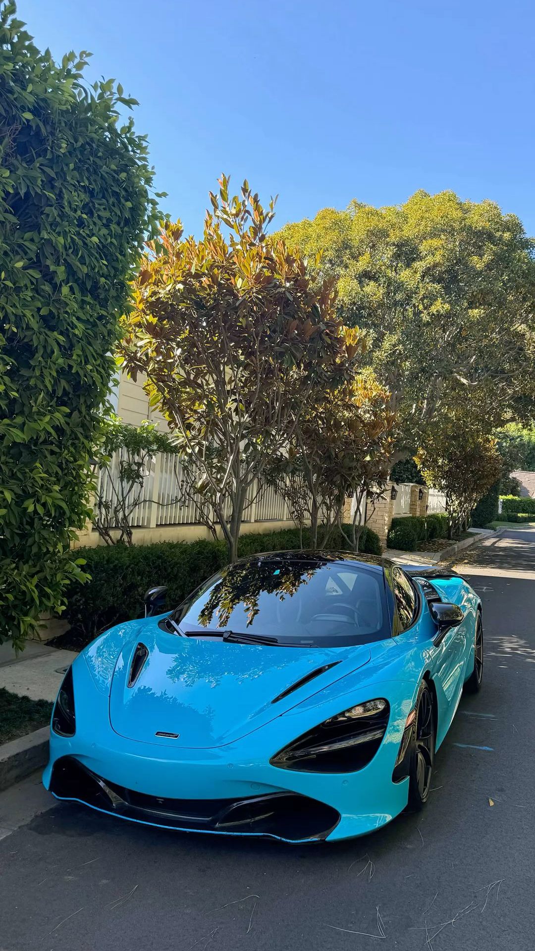 Light Blue McLaren on Residential Street