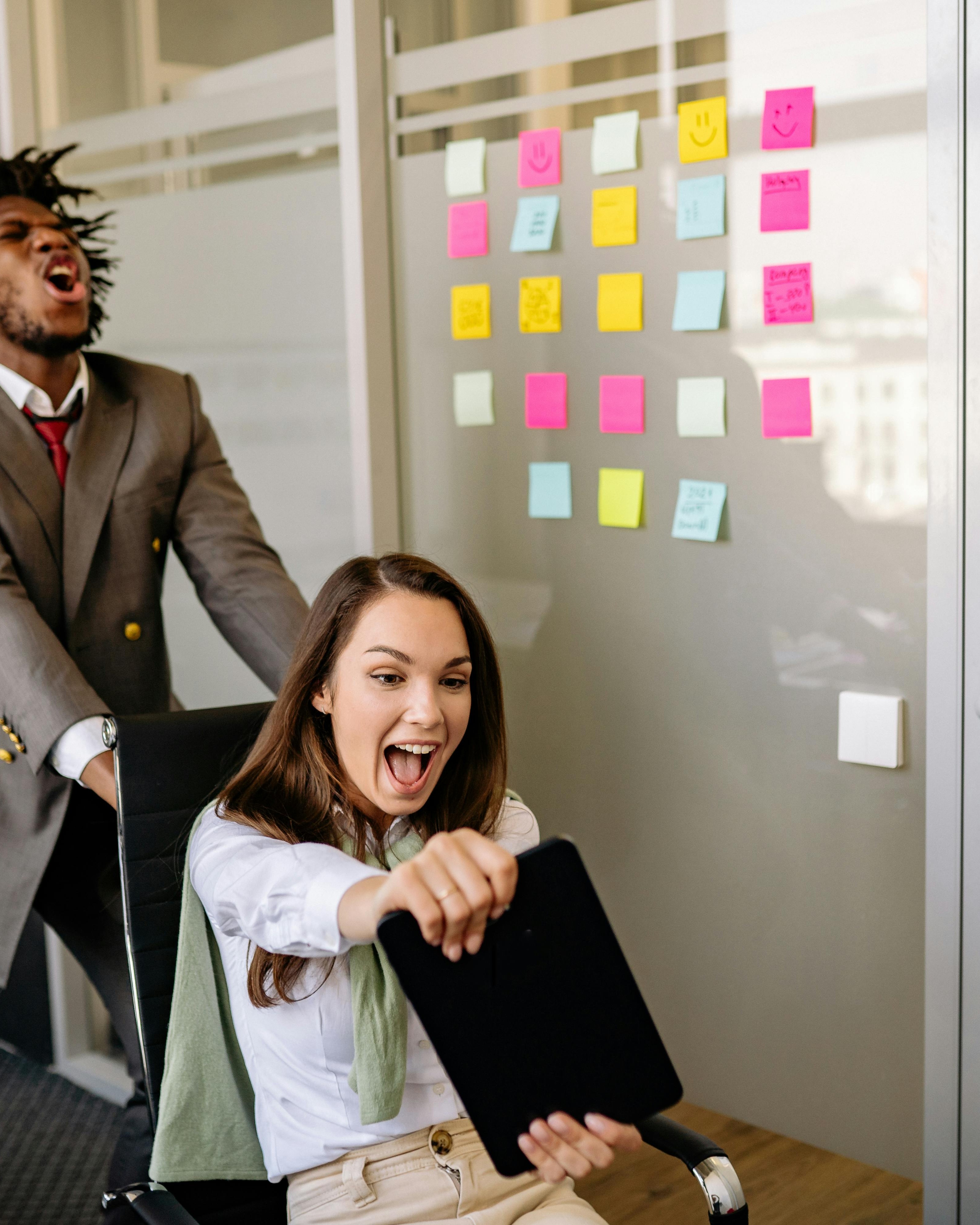 Excited Coworkers Having Fun in Office