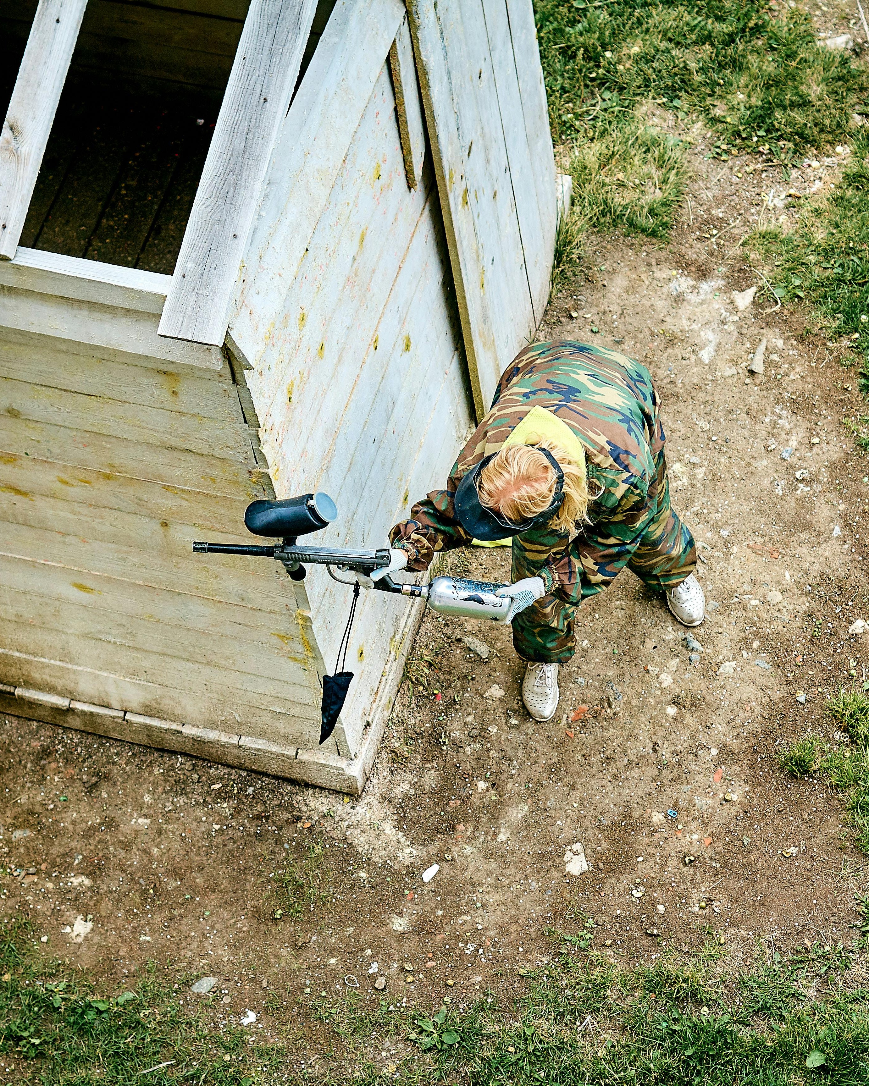 Paintball Player Taking Cover