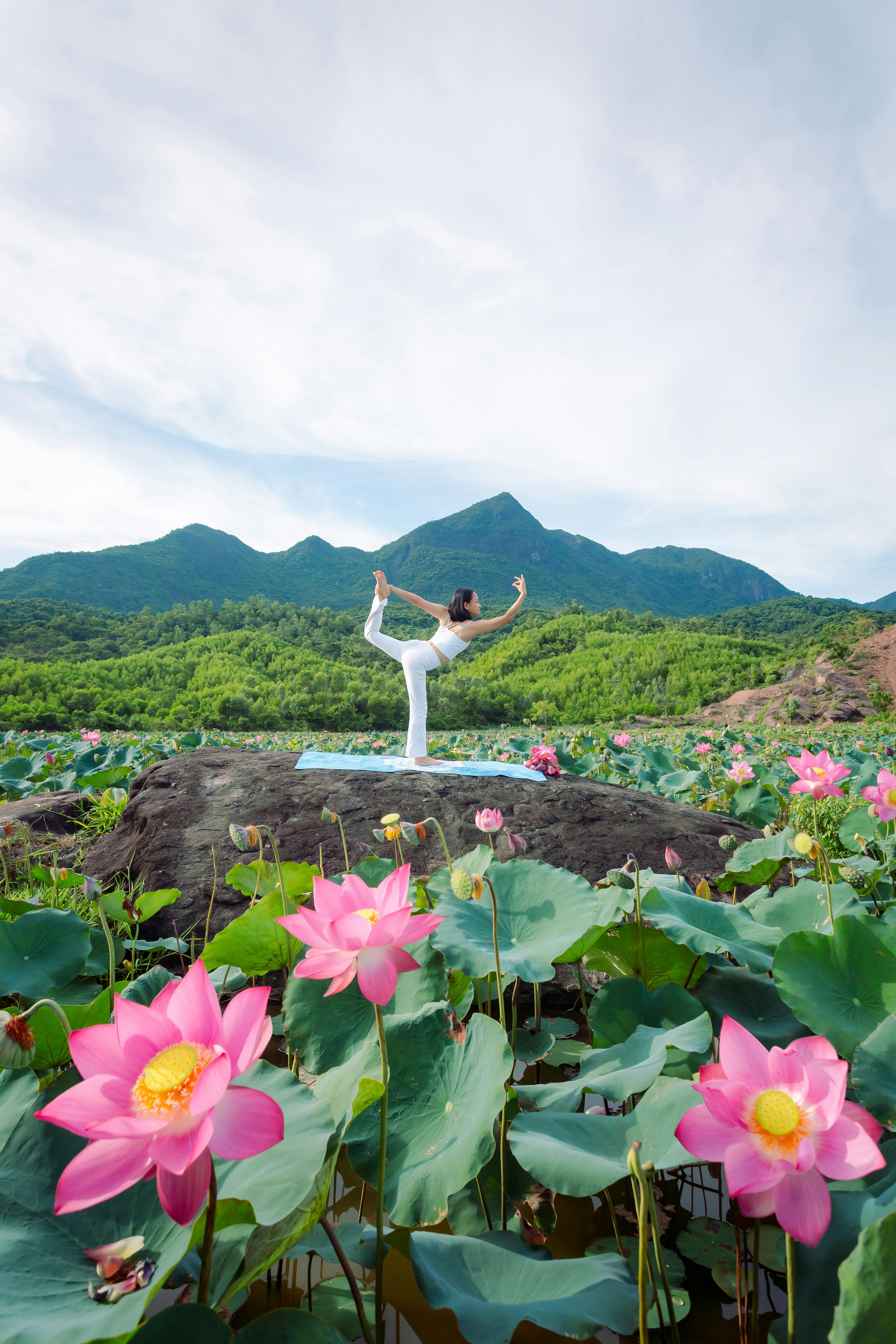 Yoga Practice by Lotus Pond with Mountains