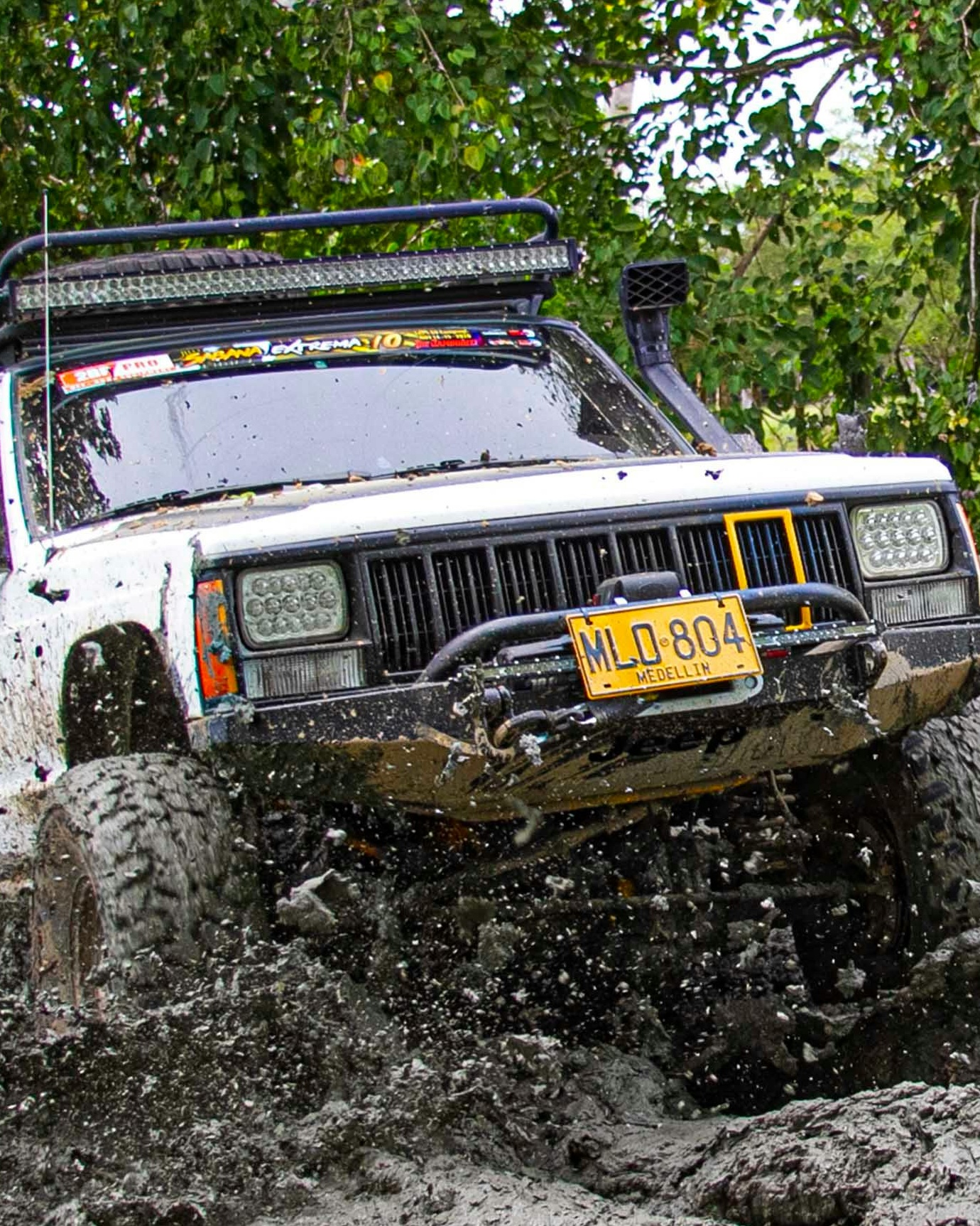 Modified Off-Road Jeep Driving Through Mud