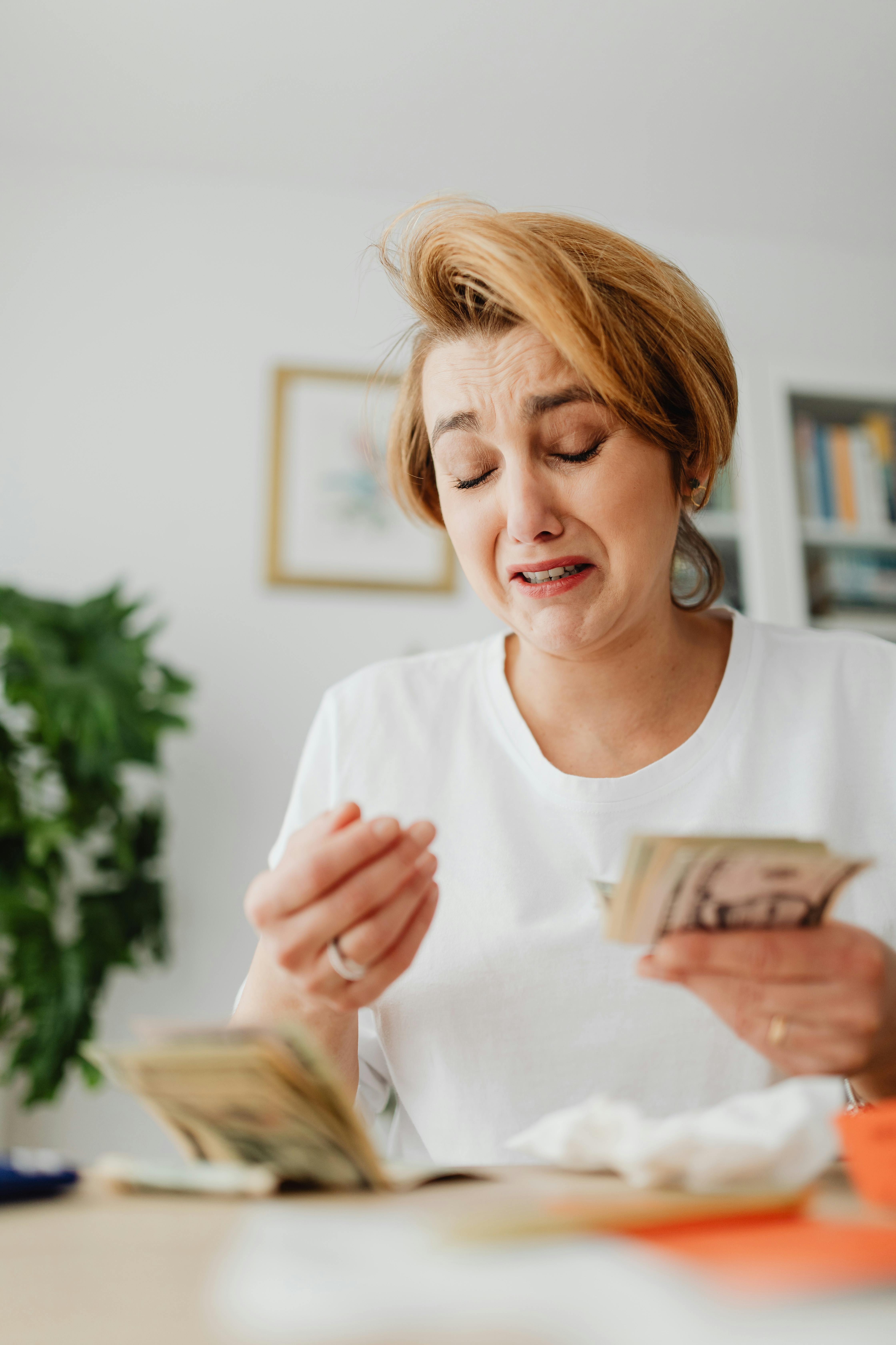 Upset Crying Woman Counting Cash